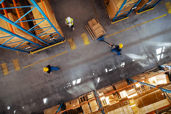 Top-Down View: In Warehouse People Working, Forklift Truck Operator Lifts Pallet with Cardboard Box. Logistics, Distribution Center with Products Ready for Global Shipment, Customer Delivery